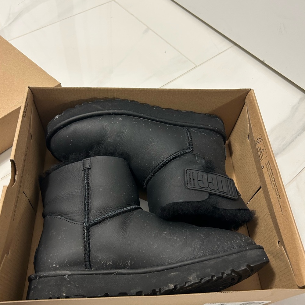 UGG Mini Bailey Logo Strap Boots in Black